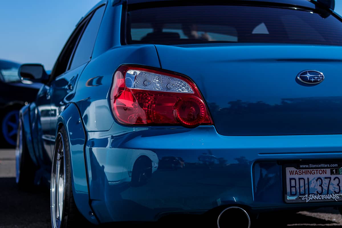 Modded Blue Subaru WRX bug eye with wide body fender flares