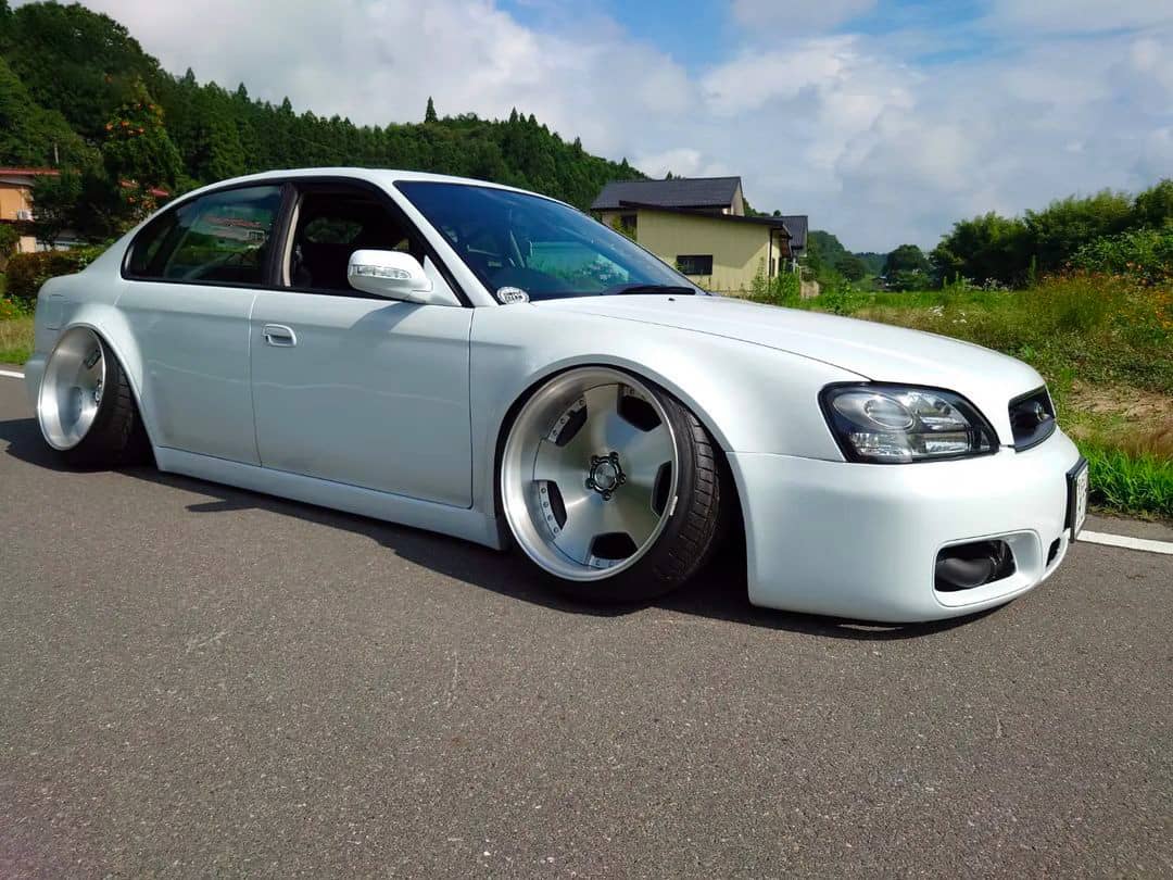 cambered Subaru Legacy B4 with shaved body kit