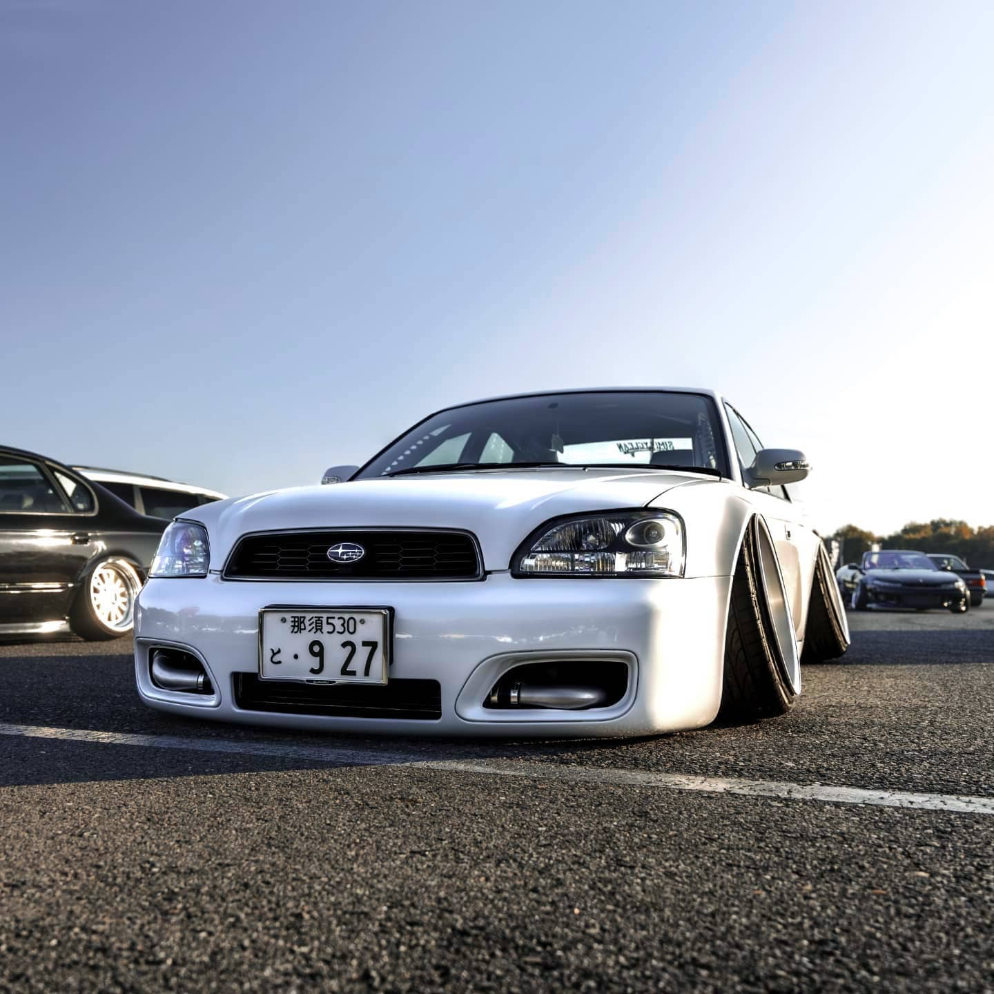 Slammed Subaru Legacy B4 GT white with custom bumper